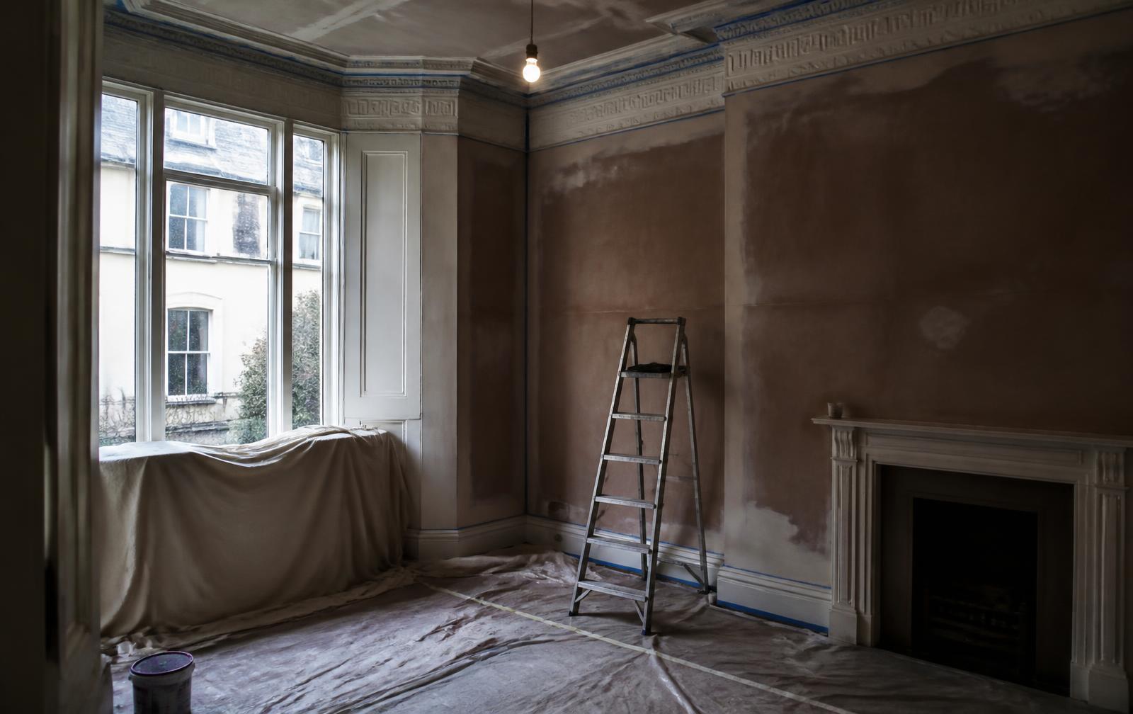 The same room during preparation, with filled walls and dust sheets